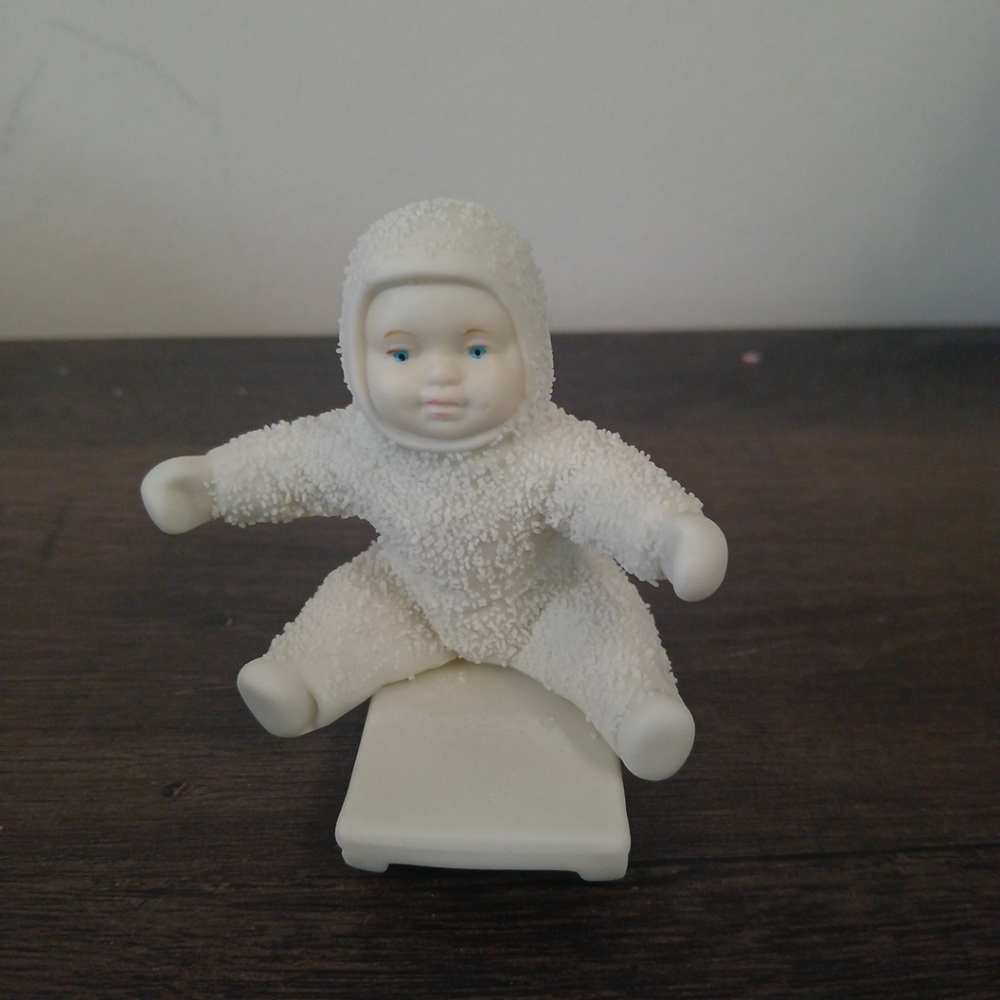 Snowbabies figurine on sled